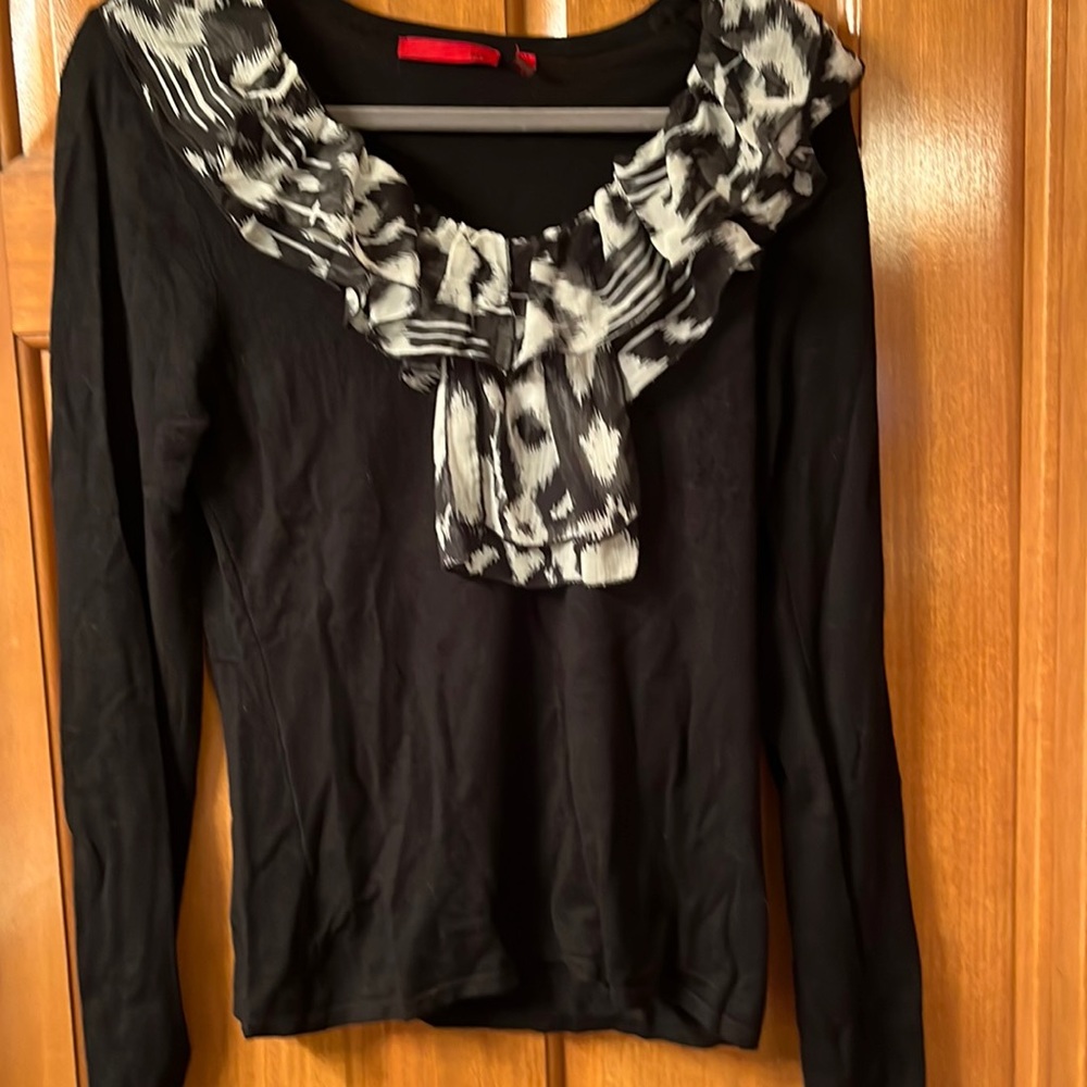 New!  Beautiful black sweater with chiffon detail.